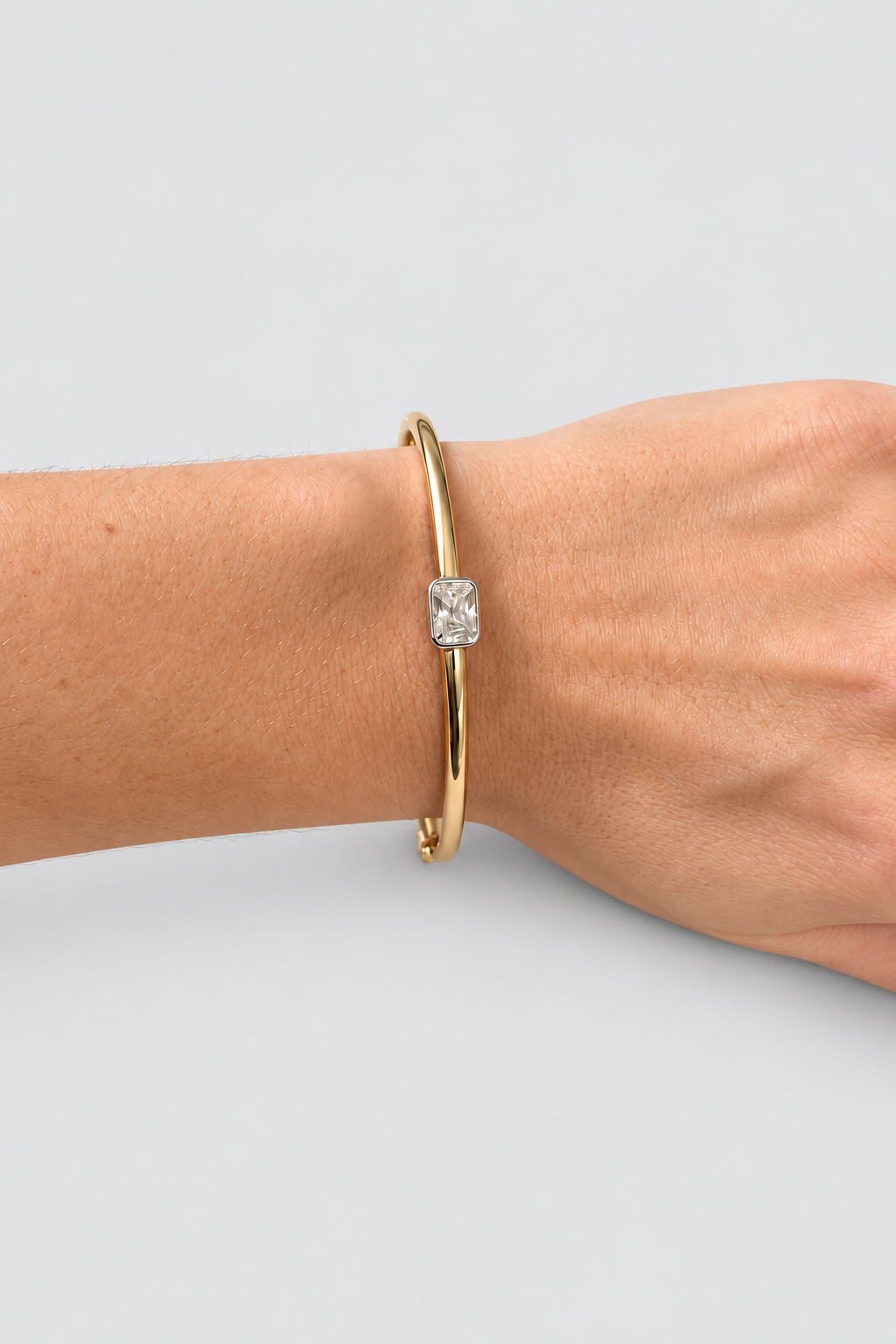 Drew Emerald Cut Bezel Two-Tone Bangle on wrist